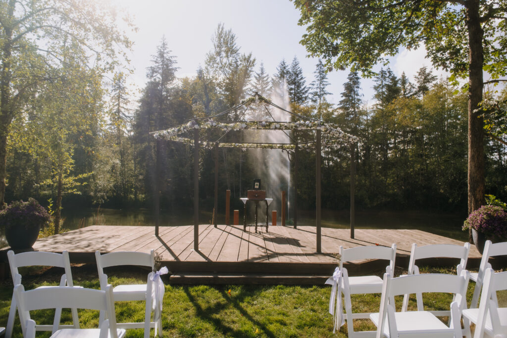 Couple sharing a kiss beneath lavender and greenery at Villa Ragalie, romantic cinematic wedding photography in Oregon.