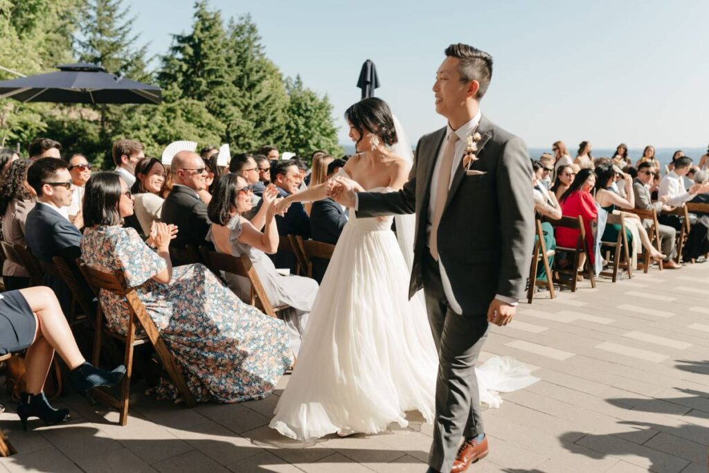 Editorial-style couple photos with vineyard and skyline backdrop