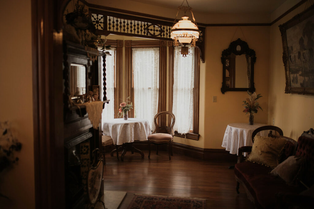 Bride getting ready in the Amanda Cole Suite at Victorian Belle Mansion