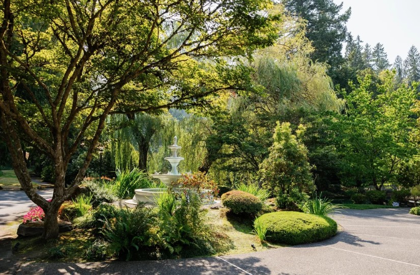 Outdoor garden wedding with ponds and fountains in Oregon