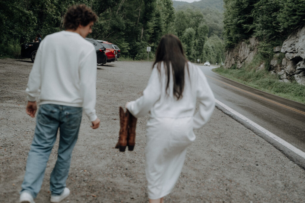 Destination engagement photos at Trash Can Falls in the Blue Ridge Mountains, with overcast skies, lush forest, and romantic waterfall backdrops. Captured by destination wedding and engagement photographer KNCAPTURES