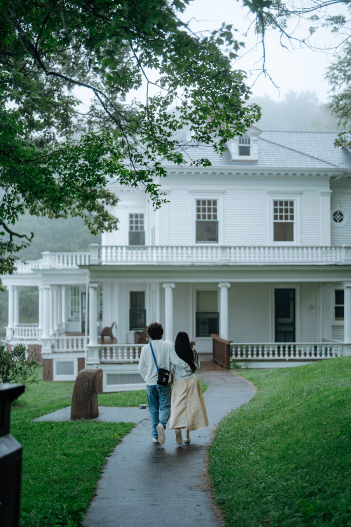 Moody North Carolina engagement photos captured at the couple’s proposal spot in the Smoky Mountains, surrounded by fog and soft overcast light. Romantic and cinematic portraits by destination wedding and engagement photographer KNCAPTURES. Moses Cone
