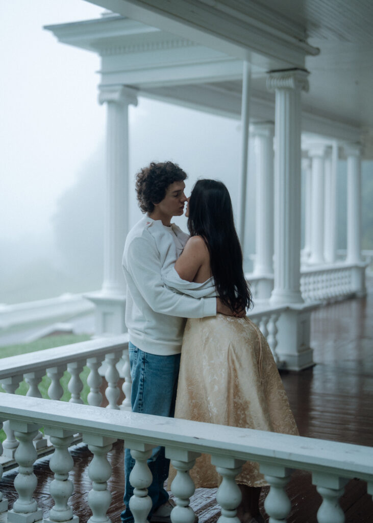 Moody North Carolina engagement photos captured at the couple’s proposal spot in the Smoky Mountains, surrounded by fog and soft overcast light. Romantic and cinematic portraits by destination wedding and engagement photographer KNCAPTURES. Moses Cone