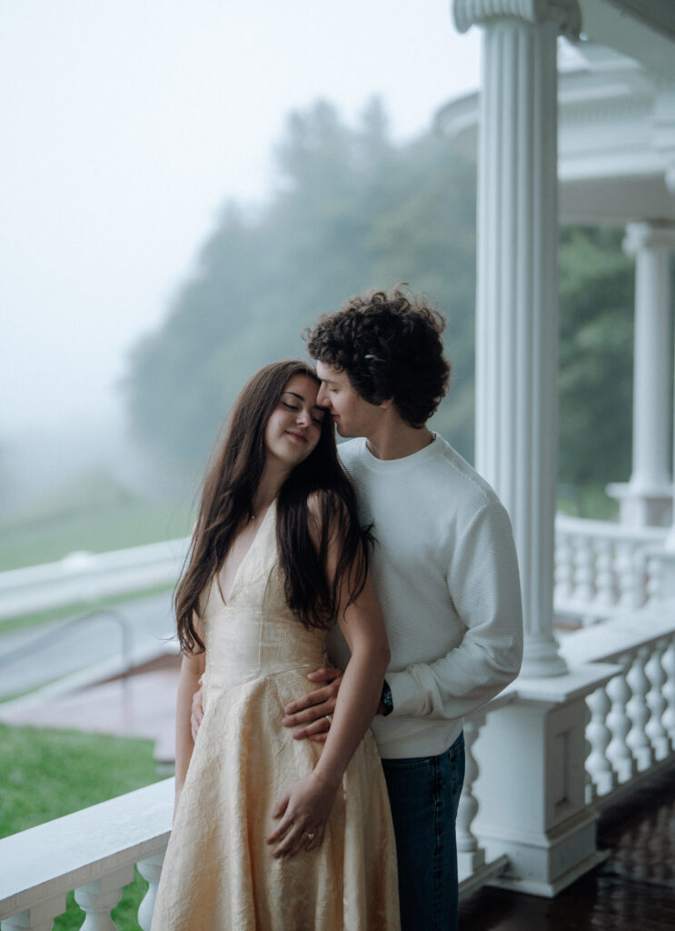 Moody North Carolina engagement photos captured at the couple’s proposal spot in the Smoky Mountains, surrounded by fog and soft overcast light. Romantic and cinematic portraits by destination wedding and engagement photographer Karmen Nichole.