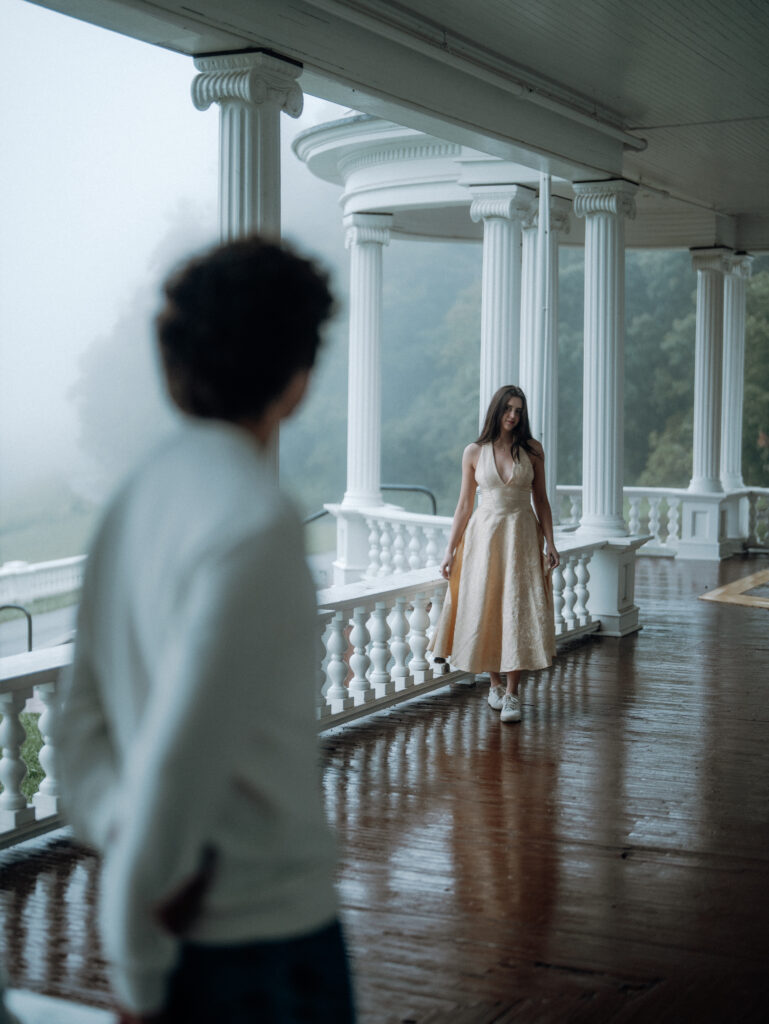 Moody North Carolina engagement photos captured at the couple’s proposal spot in the Smoky Mountains, surrounded by fog and soft overcast light. Romantic and cinematic portraits by destination wedding and engagement photographer Karmen Nichole.