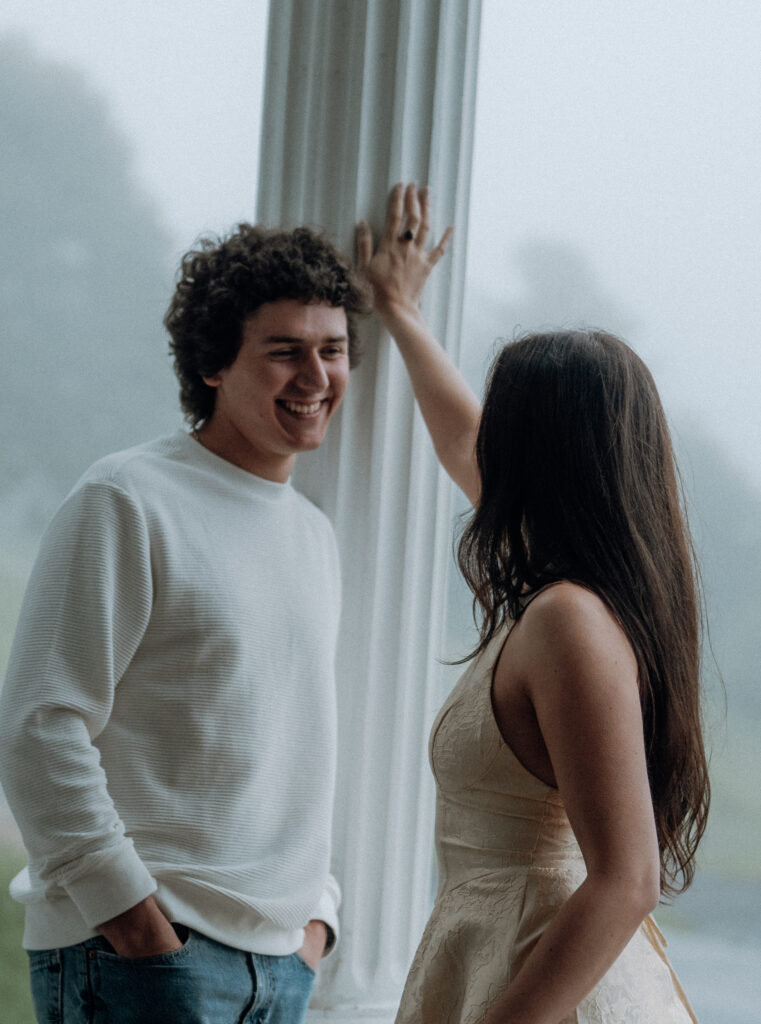 Moody North Carolina engagement photos captured at the couple’s proposal spot in the Smoky Mountains, surrounded by fog and soft overcast light. Romantic and cinematic portraits by destination wedding and engagement photographer KNCAPTURES. Moses Cone