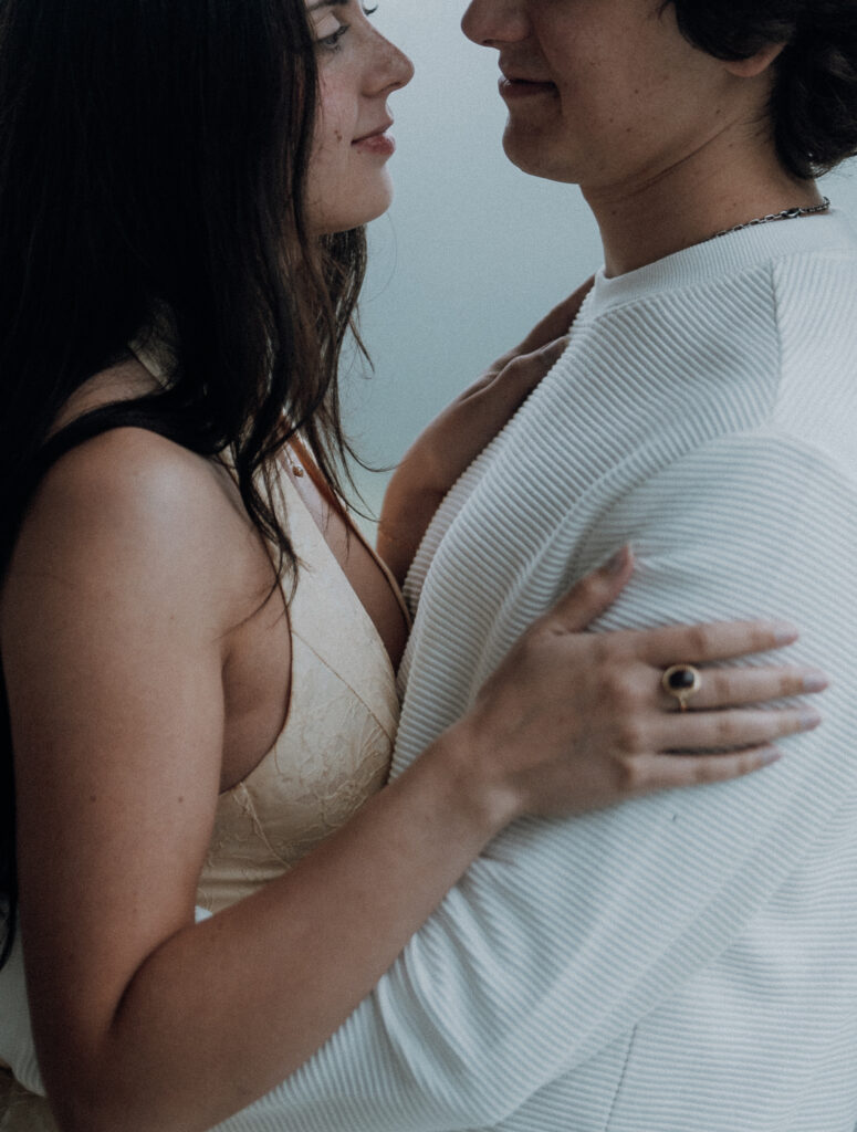 Moody North Carolina engagement photos captured at the couple’s proposal spot in the Smoky Mountains, surrounded by fog and soft overcast light. Romantic and cinematic portraits by destination wedding and engagement photographer KNCAPTURES. Moses Cone