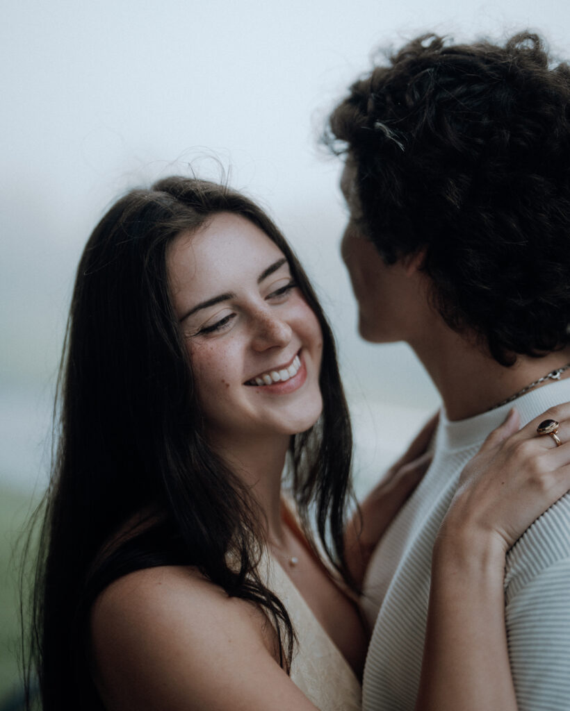 Moody North Carolina engagement photos captured at the couple’s proposal spot in the Smoky Mountains, surrounded by fog and soft overcast light. Romantic and cinematic portraits by destination wedding and engagement photographer KNCAPTURES. Moses Cone