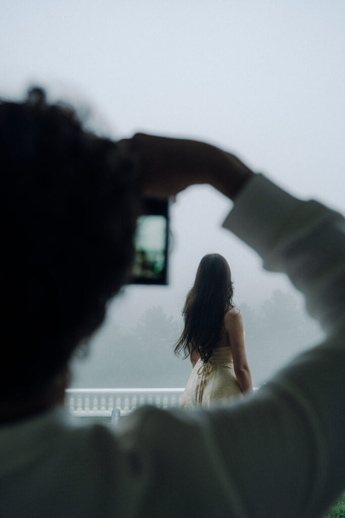 Moody North Carolina engagement photos captured at the couple’s proposal spot in the Smoky Mountains, surrounded by fog and soft overcast light. Romantic and cinematic portraits by destination wedding and engagement photographer Karmen Nichole.