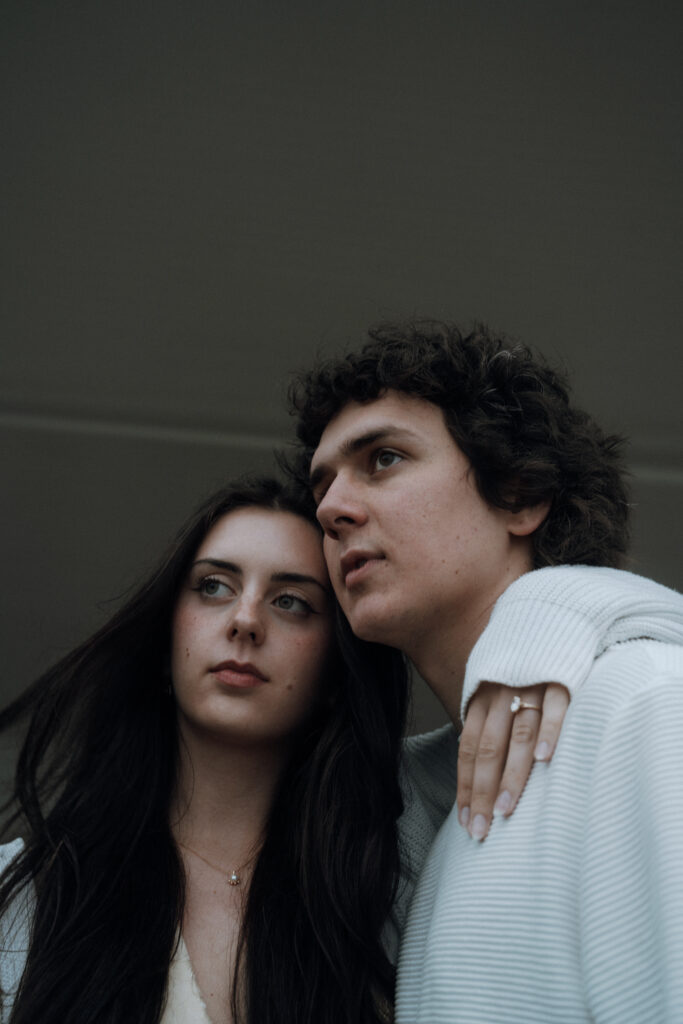 Moody North Carolina engagement photos captured at the couple’s proposal spot in the Smoky Mountains, surrounded by fog and soft overcast light. Romantic and cinematic portraits by destination wedding and engagement photographer KNCAPTURES. Moses Cone
