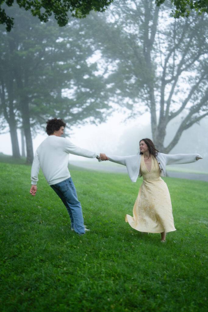 Moody North Carolina engagement photos captured at the couple’s proposal spot in the Smoky Mountains, surrounded by fog and soft overcast light. Romantic and cinematic portraits by destination wedding and engagement photographer KNCAPTURES. Moses Cone
