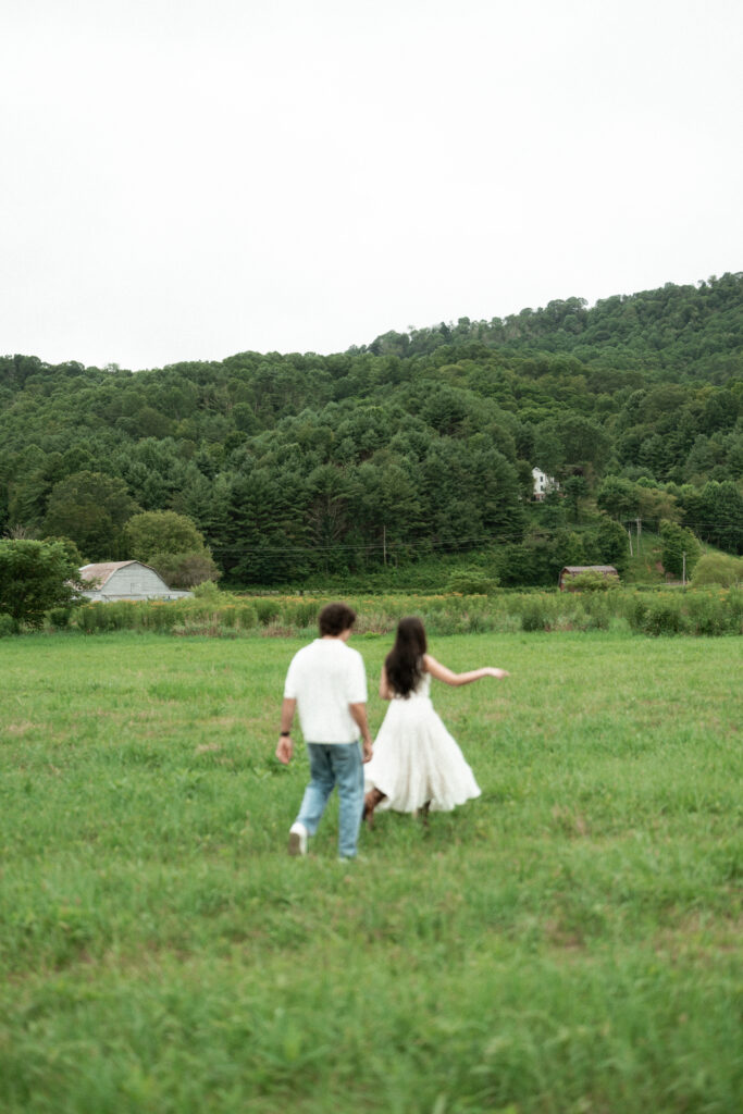 Engagement session in a misty mountain park in North Carolina, captured after the rain with soft, diffused light and natural tones. Emotional, candid moments by destination wedding photographer KNCAPTURES