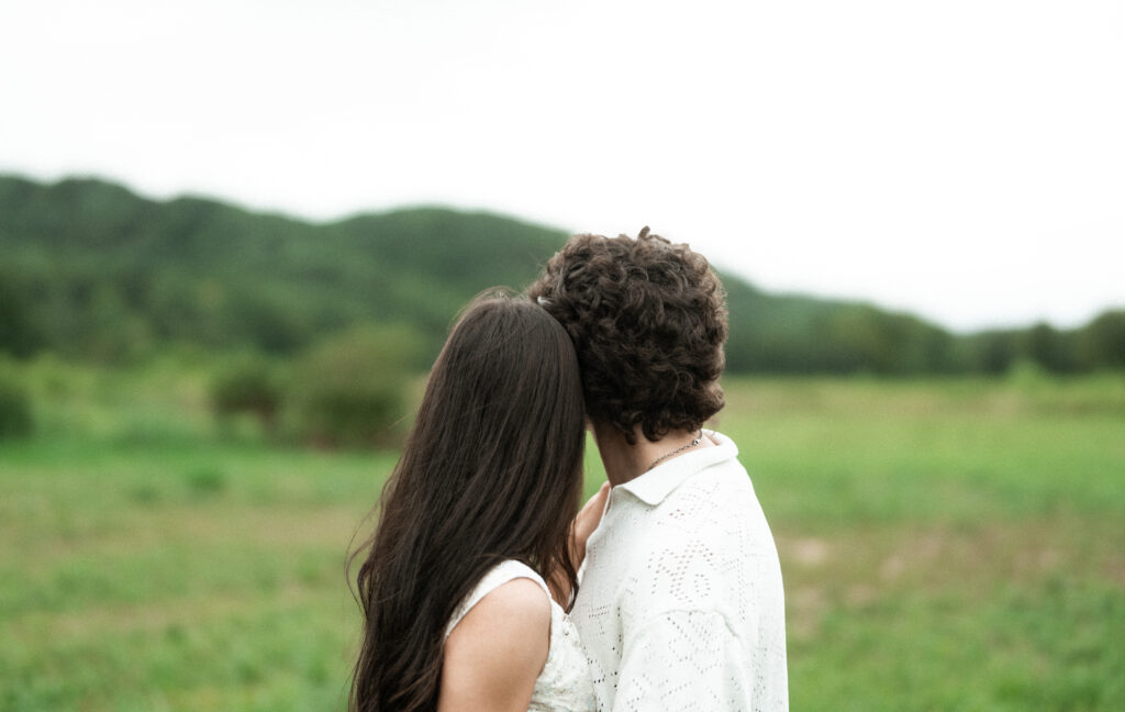 ngagement session in a misty mountain park in North Carolina, captured after the rain with soft, diffused light and natural tones. Emotional, candid moments by destination engagement photographer KNCAPTURES
