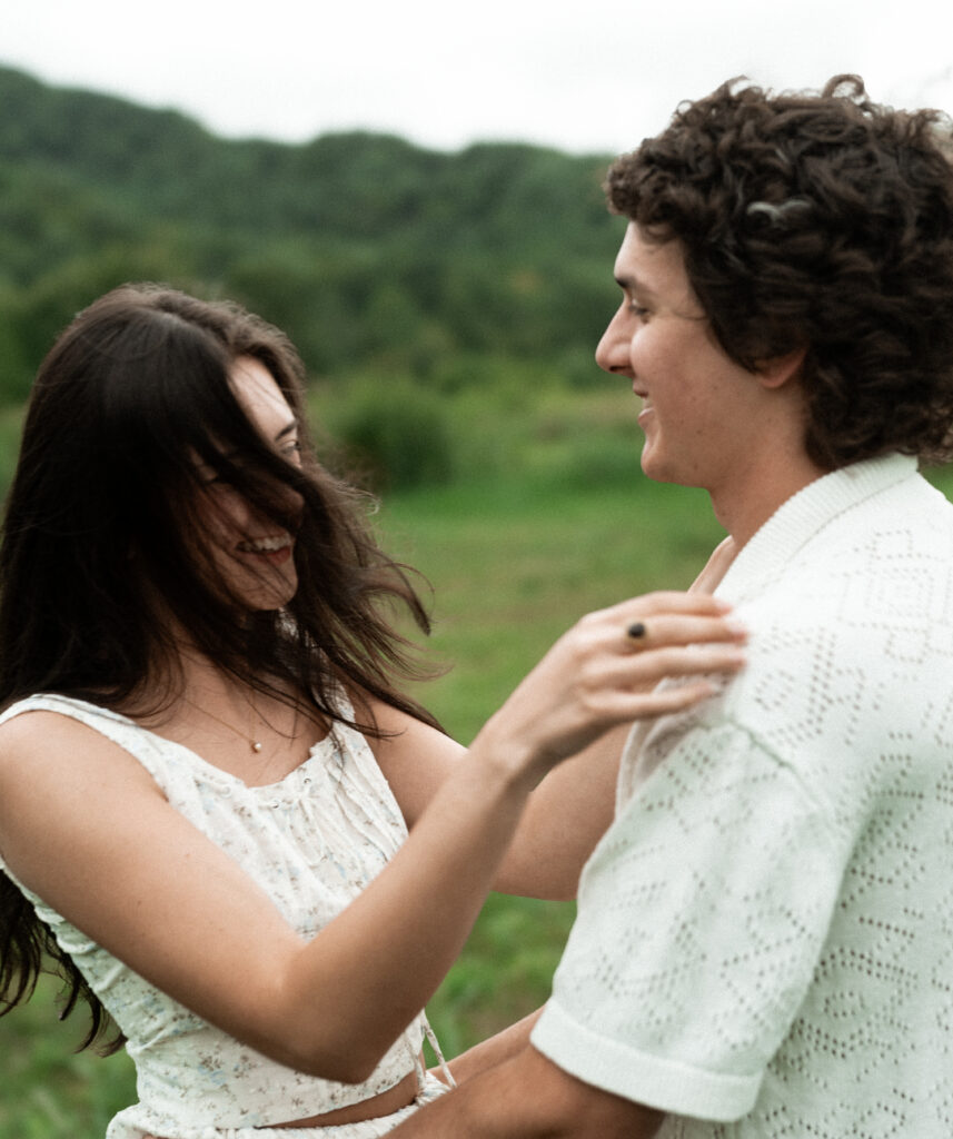 Engagement session in a misty mountain park in North Carolina, captured after the rain with soft, diffused light and natural tones. Emotional, candid moments by destination wedding photographer KNCAPTURES
