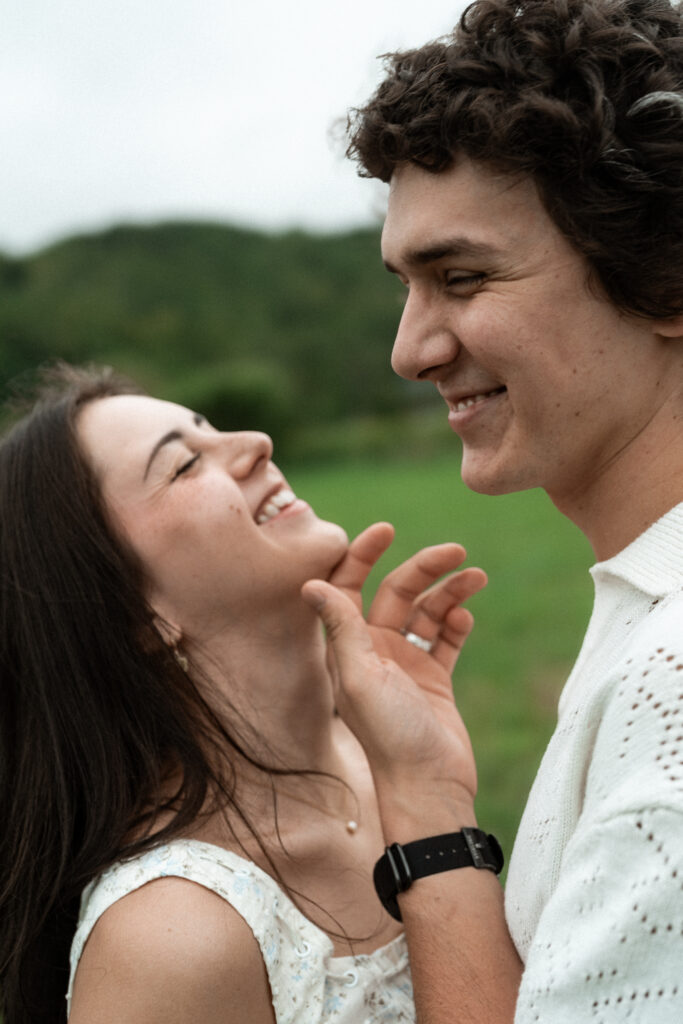 Engagement session in a misty mountain park in North Carolina, captured after the rain with soft, diffused light and natural tones. Emotional, candid moments by destination wedding photographer KNCAPTURES