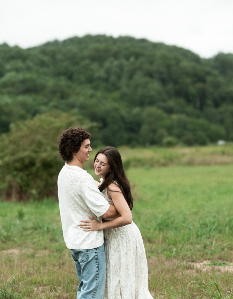 Engagement session in a misty mountain park in North Carolina, captured after the rain with soft, diffused light and natural tones. Emotional, candid moments by destination wedding photographer KNCAPTURES