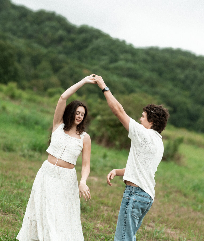 Engagement session in a misty mountain park in North Carolina, captured after the rain with soft, diffused light and natural tones. Emotional, candid moments by destination wedding photographer KNCAPTURES