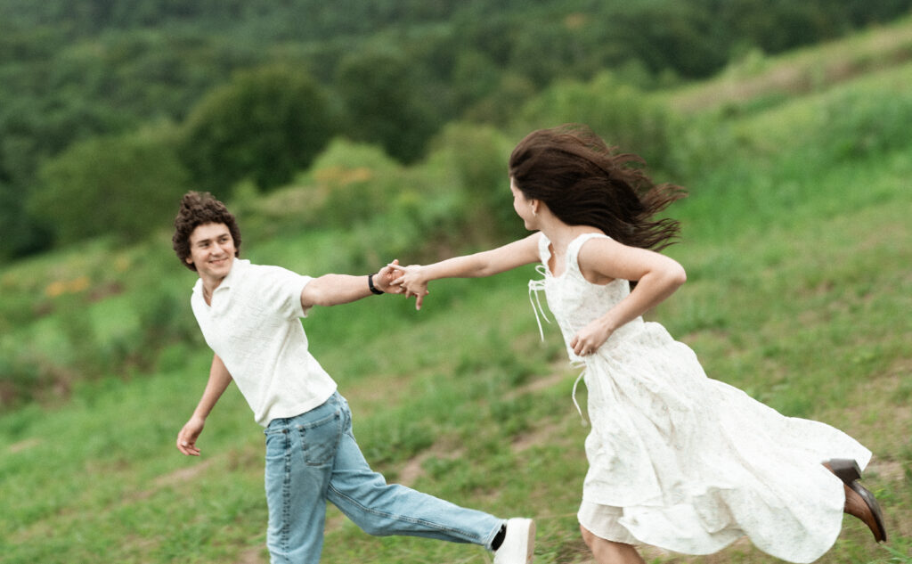 Engagement session in a misty mountain park in North Carolina, captured after the rain with soft, diffused light and natural tones. Emotional, candid moments by destination wedding photographer KNCAPTURES