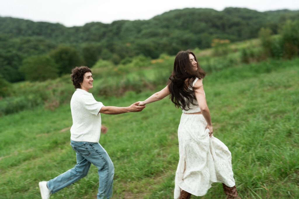 Engagement session in a misty mountain park in North Carolina, captured after the rain with soft, diffused light and natural tones. Emotional, candid moments by destination wedding photographer KNCAPTURES