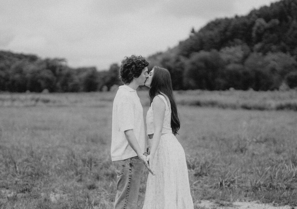 Engagement session in a misty mountain park in North Carolina, captured after the rain with soft, diffused light and natural tones. Emotional, candid moments by destination wedding photographer KNCAPTURES