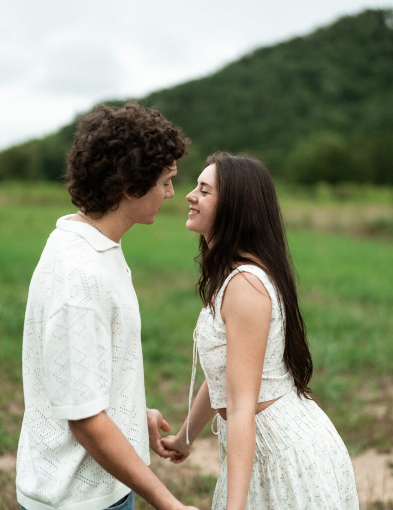 Engagement session in a misty mountain park in North Carolina, captured after the rain with soft, diffused light and natural tones. Emotional, candid moments by destination wedding photographer KNCAPTURES
