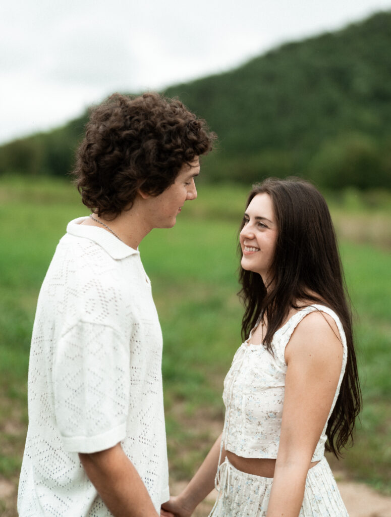 Engagement session in a misty mountain park in North Carolina, captured after the rain with soft, diffused light and natural tones. Emotional, candid moments by destination wedding photographer KNCAPTURES