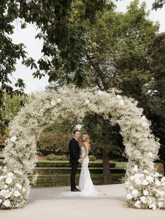 Elegant vineyard wedding ceremony with Mt. Hood in distance