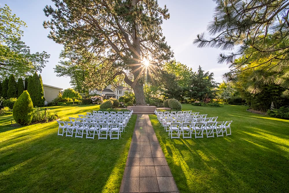 Ainsworth House and Gardens wedding in Oregon City — romantic garden venue with 200-year-old pine tree ceremony site and historic home for getting ready.