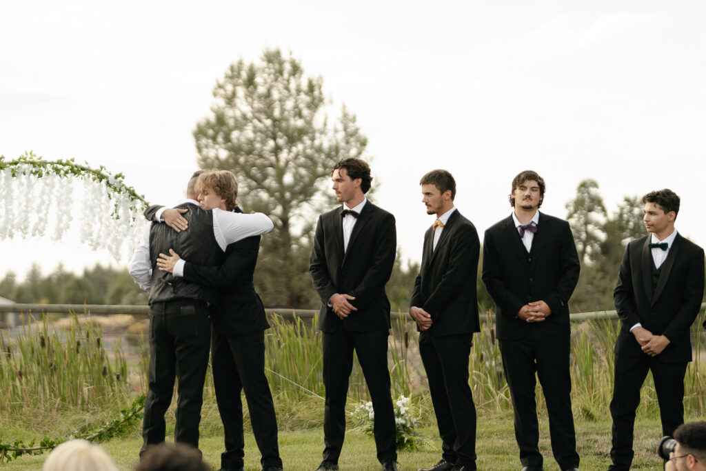 groom crying as bride walks down the aisle bend oregon wedding 