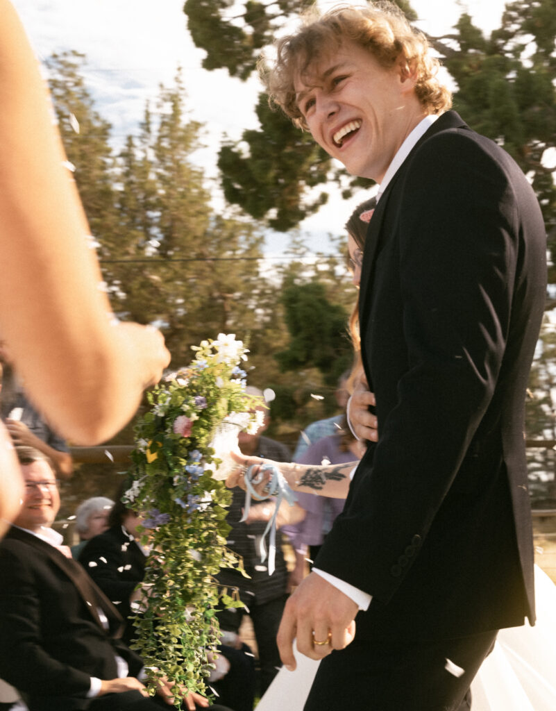 couple walking down aisle to confetti bend oregon wedding photography