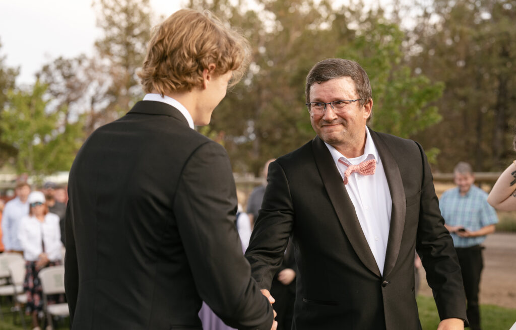father handing off bride at wedding bend oregon 