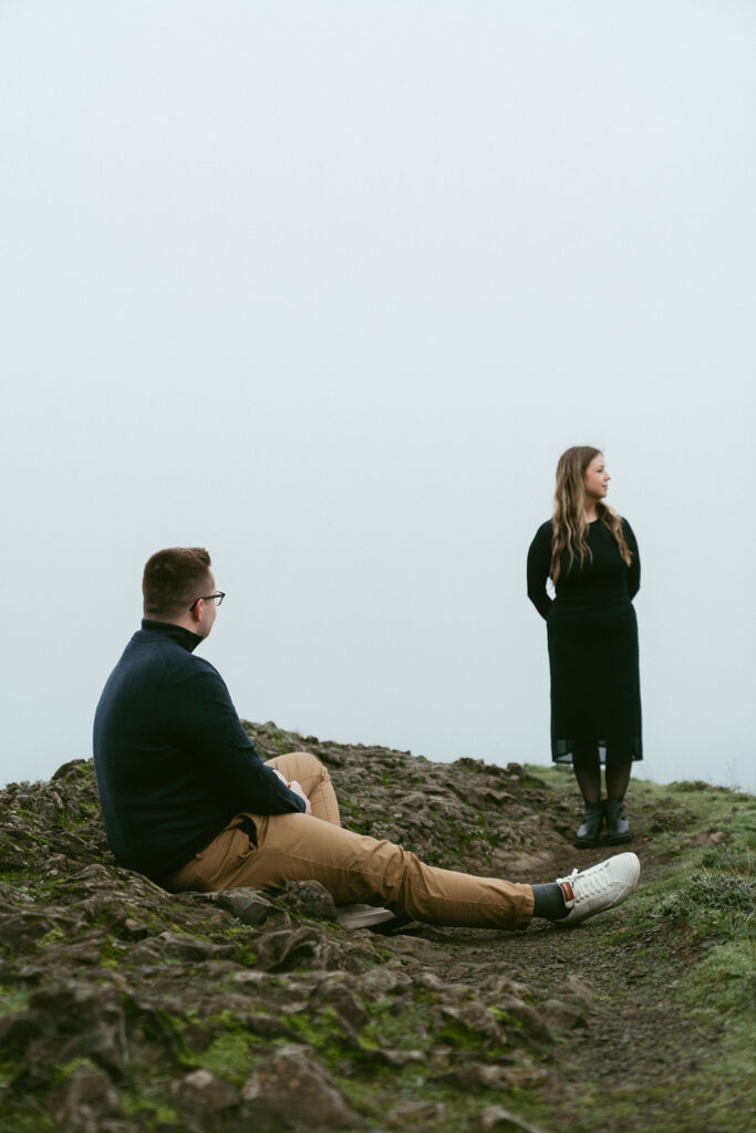 Couple embracing at Crown Point Vista House overlooking the Columbia River Gorge in Oregon