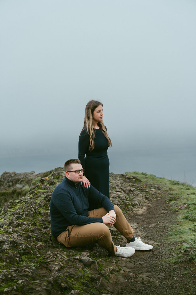 Couple embracing at Crown Point Vista House overlooking the Columbia River Gorge in Oregon