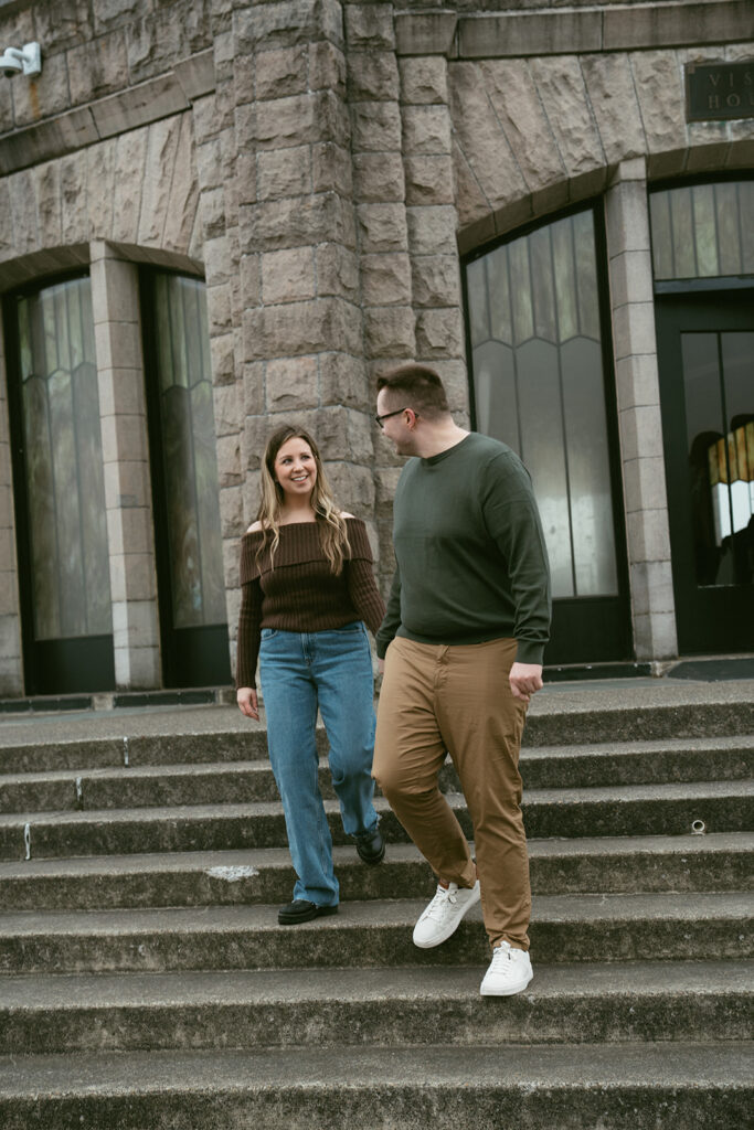 Couple embracing at Crown Point Vista House overlooking the Columbia River Gorge in Oregon