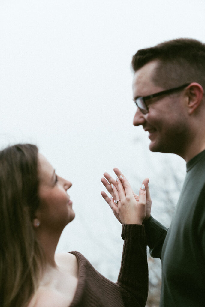 Couple embracing at Crown Point Vista House overlooking the Columbia River Gorge in Oregon