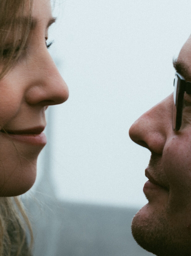 Couple embracing at Crown Point Vista House overlooking the Columbia River Gorge in Oregon