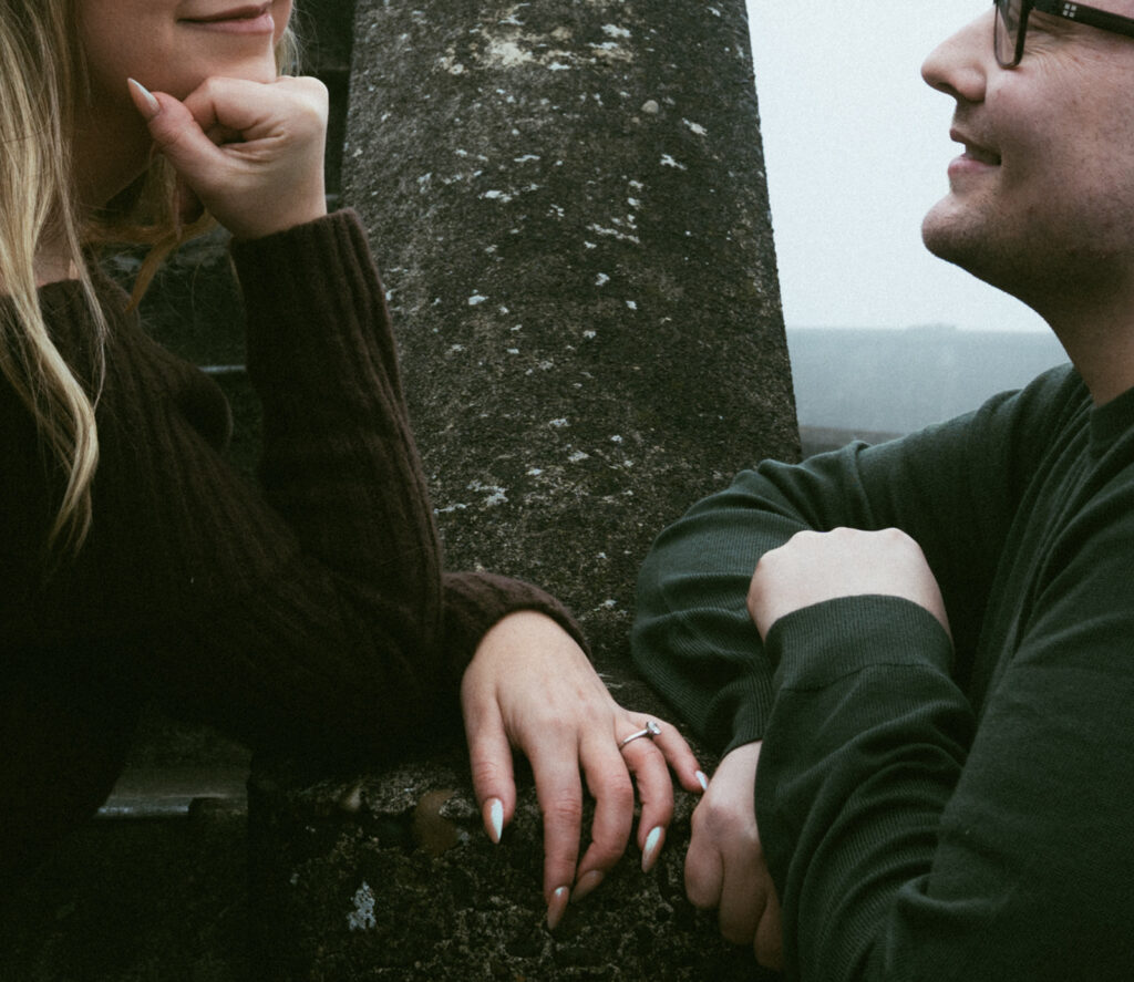 Couple embracing at Crown Point Vista House overlooking the Columbia River Gorge in Oregon