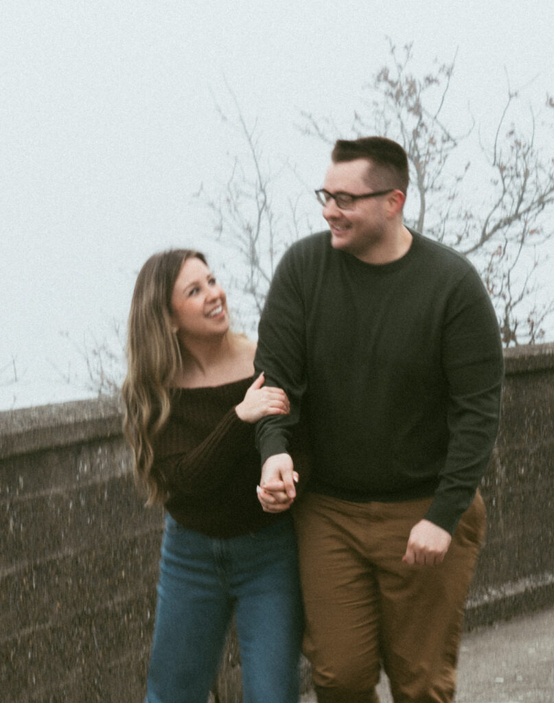 Couple embracing at Crown Point Vista House overlooking the Columbia River Gorge in Oregon