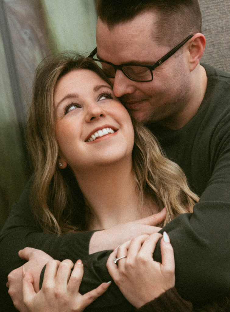 Couple embracing at Crown Point Vista House overlooking the Columbia River Gorge in Oregon