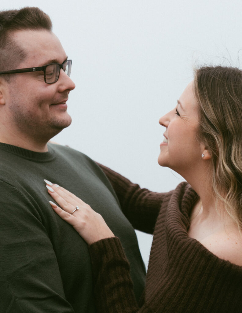 Couple embracing at Crown Point Vista House overlooking the Columbia River Gorge in Oregon